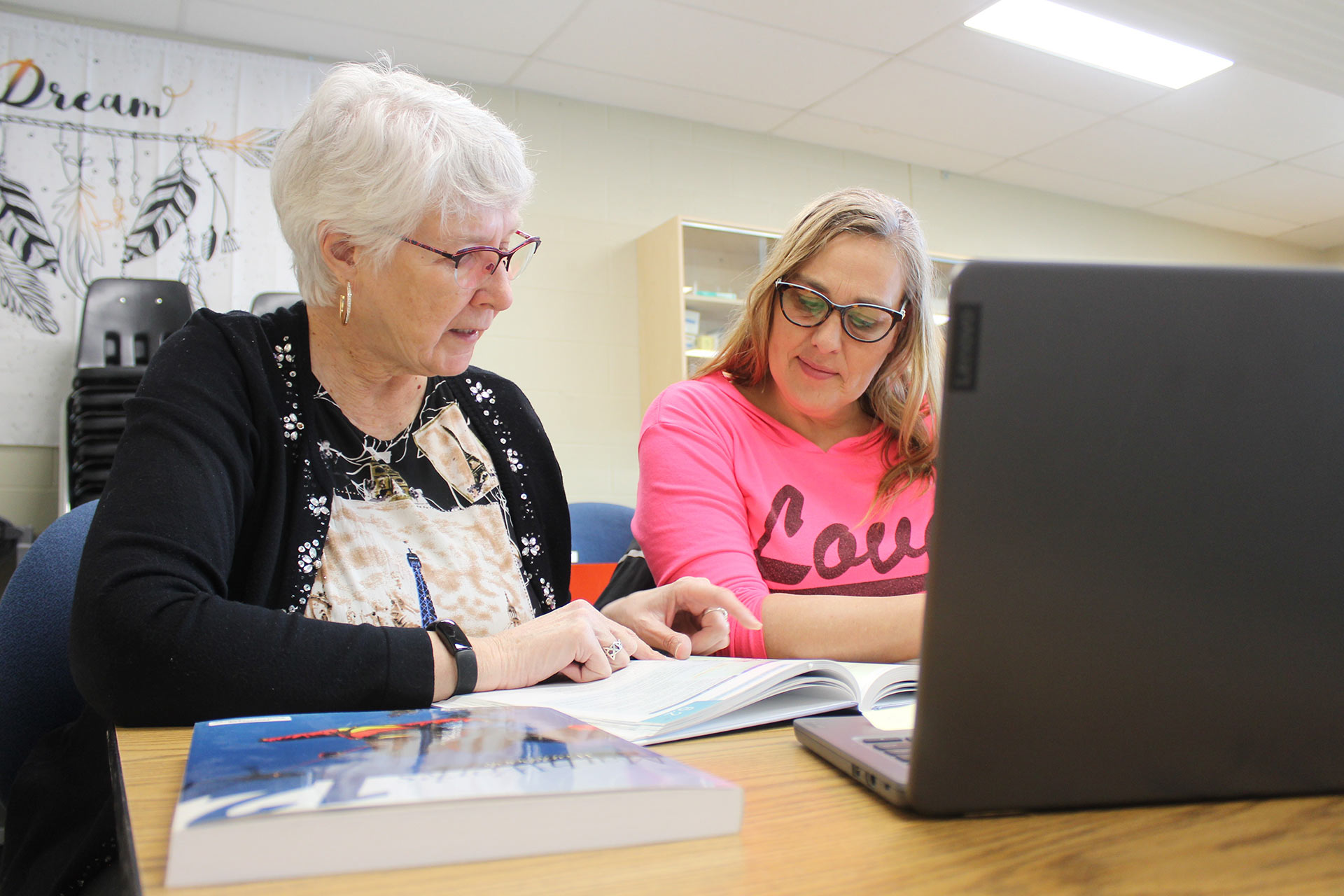 College instructor works one-on-one with student in a classroom in Humboldt